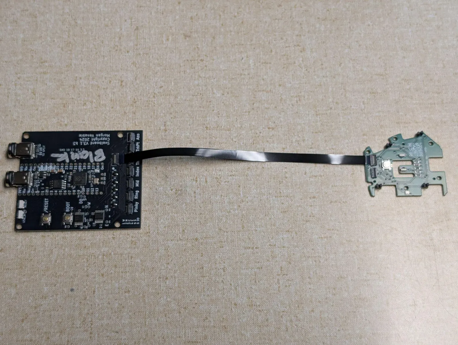 An MCU connected to a finger cluster PCBA by an FFC.