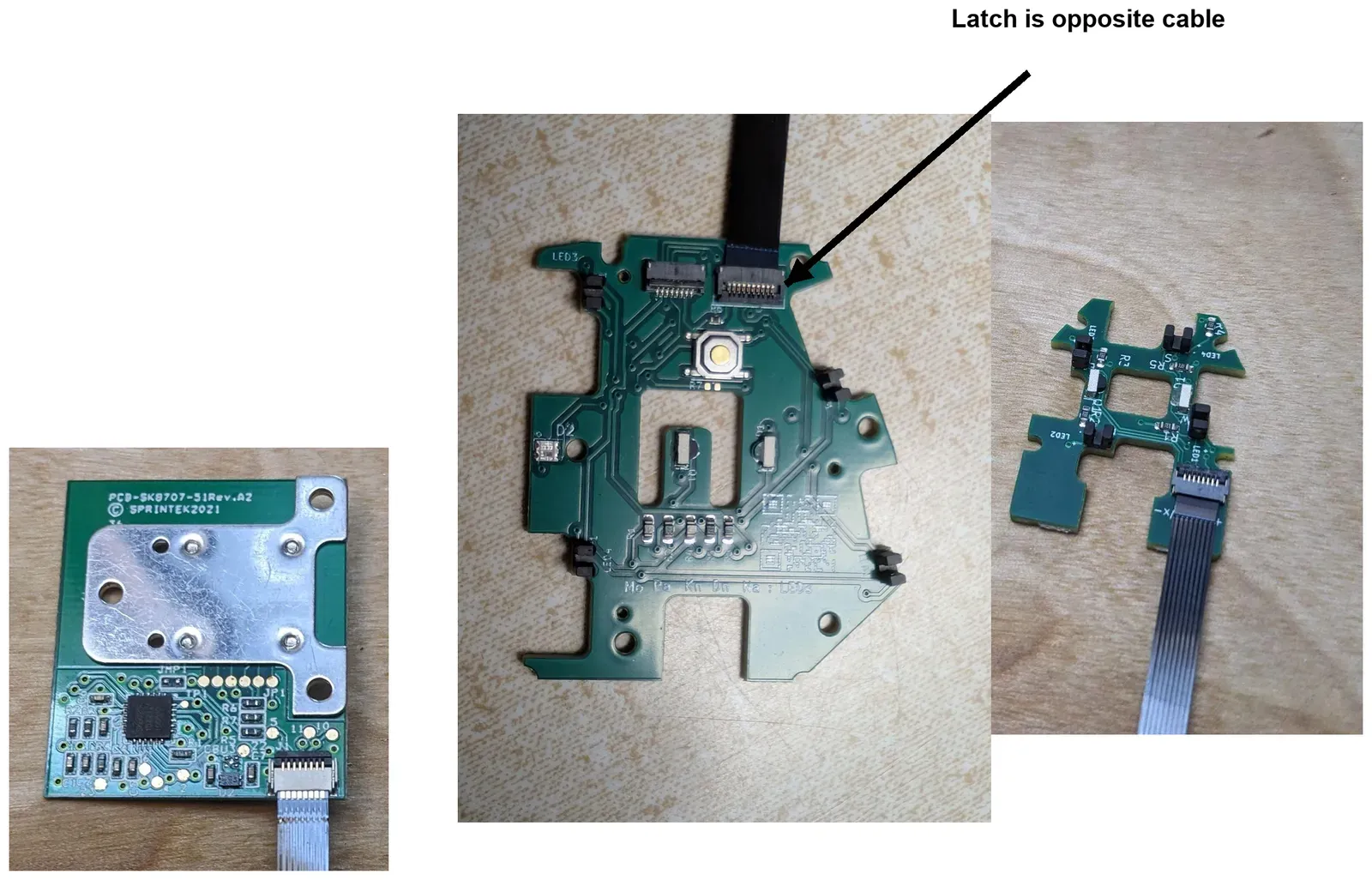 FFCs attached to a trackball PCBA, a thumb PCBA and a finger cluster PCBA. On the thumb PCBA the latch sits on the side opposite the cable.