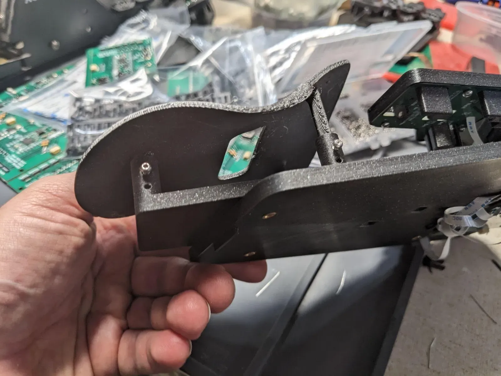 A palm rest seated in its sled on the base plate.