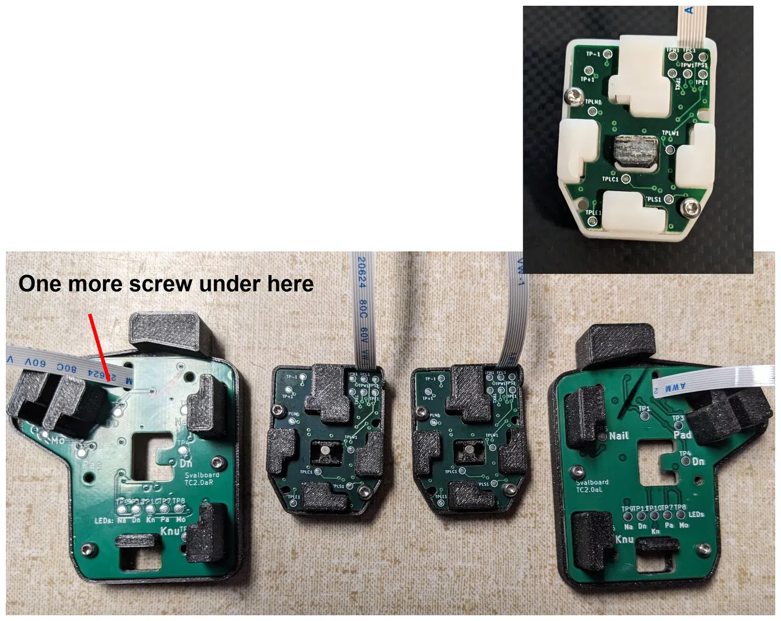 Thumb and finger cluster PCBAs screwed into their clusters. A red line marks one more thumb screw hidden under a key. Inset: a finger cluster PCBA with its two screws.